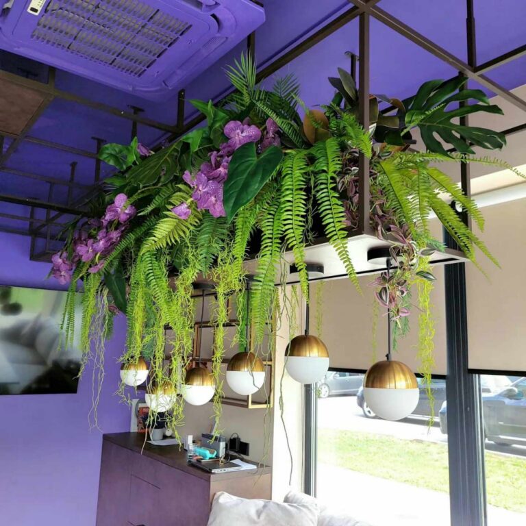 Box with artificial plants and flowers